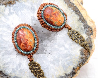 Earrings, Intriguing Leopard Jasper cabochon bead embroidered, Handmade in Colorado, Brass Feather charm, Post earring finding