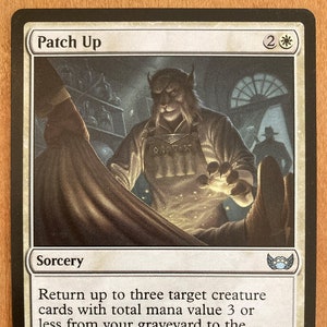 May include: A white card with a light brown background featuring a fantasy creature with horns and a beard. The card is titled "Patch Up" and has a mana cost of 2 white mana. The card text reads "Return up to three target creature cards with total mana value 3 or less from your graveyard to the battlefield." The card also includes the text "Don't tell me who sent you or who you work for. The less I know, the better."