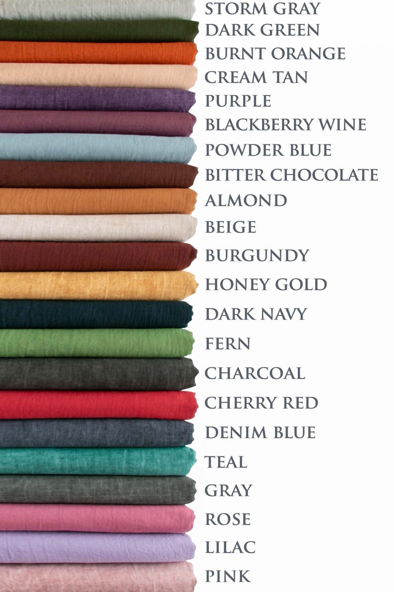 May include: A stack of fabric swatches in various colors, including storm gray, dark green, burnt orange, and purple. The image also displays the names of the colors, such as "Cherry Red" and "Denim Blue."
