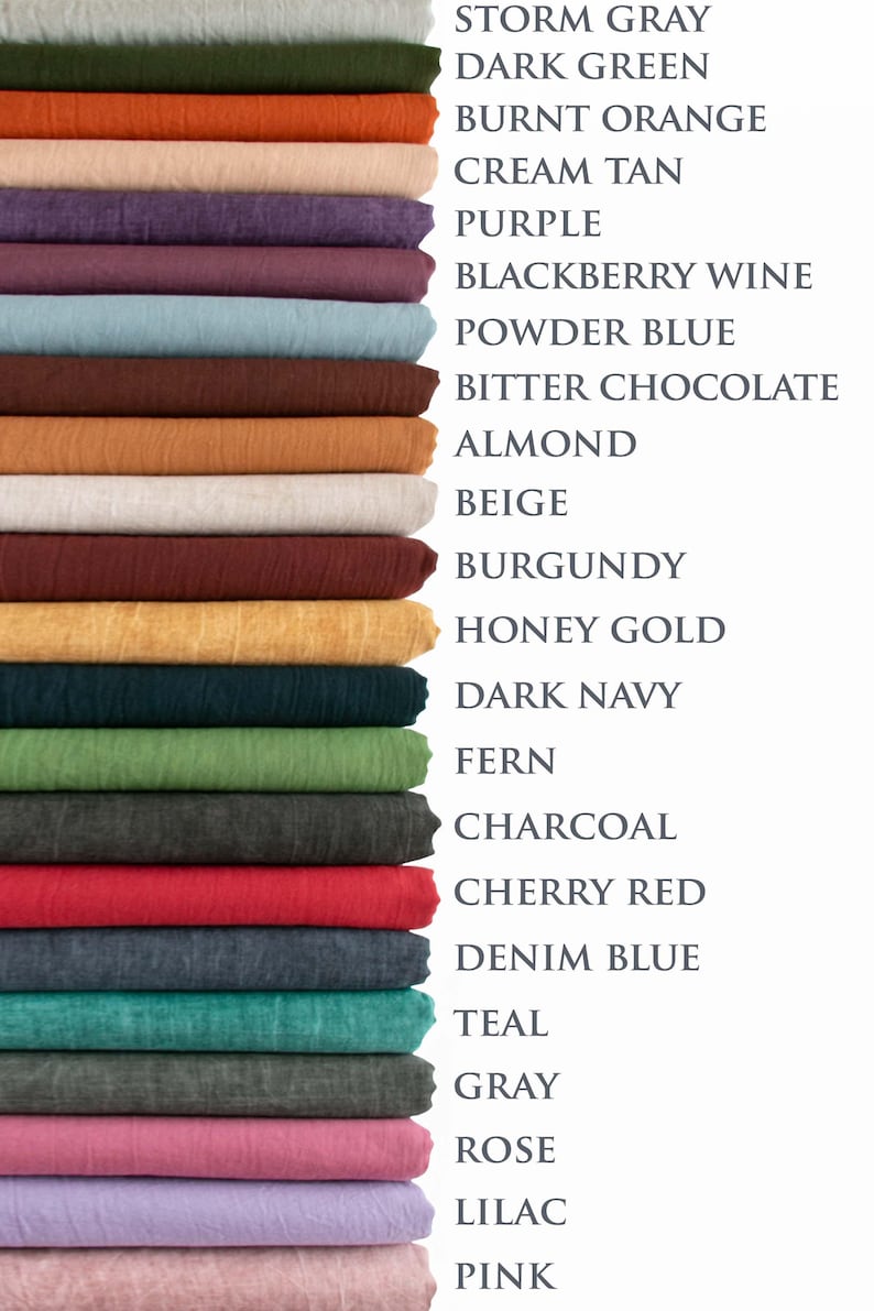May include: A stack of fabric swatches in various colors, including storm gray, dark green, burnt orange, and purple. The image also displays the names of the colors, such as "Cherry Red" and "Denim Blue."