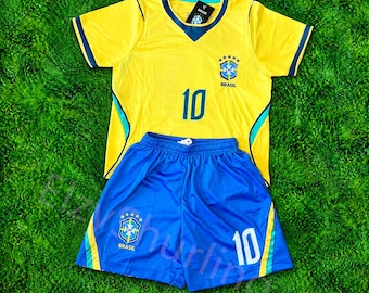 May include: A yellow short-sleeve soccer jersey with blue trim and the number 10 in blue, paired with blue soccer shorts featuring the number 10 in white. Both pieces display the Brazil national team crest with five stars above it.