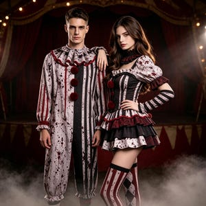 May include: A clown costume set featuring a long-sleeved jumpsuit with a ruffled collar and three red pom-poms, and a dress with a ruffled skirt, puff sleeves, and matching arm warmers. Both pieces feature a white, black, and red blood-splatter print.
