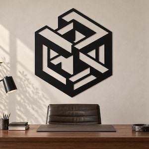 May include: A black metal wall art piece featuring an intricate geometric design composed of interconnected lines and shapes that create an optical illusion of a three-dimensional cube structure mounted on a flat surface.
