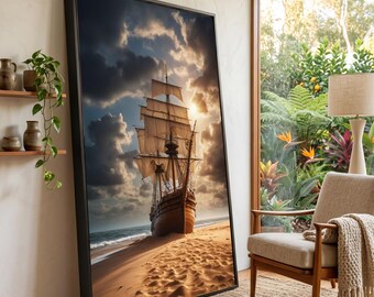 May include: A large rectangular framed wall art piece depicting a tall wooden sailing ship beached on a sandy shore under a dramatic cloudy sky with golden sunlight. The artwork features a dark frame and is positioned upright on a floor.