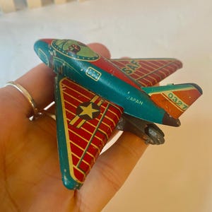 Vintage tin Japanese toy airplane made in Japan 1950s