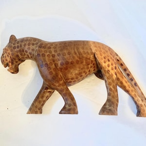 Carved wood spotted leopard tribal decor