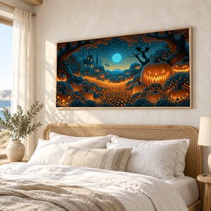 May include: A rectangular wall art print featuring a nighttime Halloween scene with glowing orange jack-o'-lanterns, dark blue trees, a bright full moon, and a silhouette of a house in the distance, all framed in a thin light wood border.