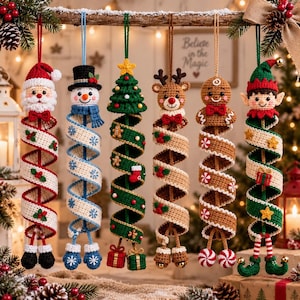 May include: Six hanging crochet Christmas ornaments featuring a Santa Claus, a snowman, a Christmas tree, a reindeer, a gingerbread person, and an elf. Each figure is attached to a long, spiraling, colorful crocheted ribbon with festive accents.