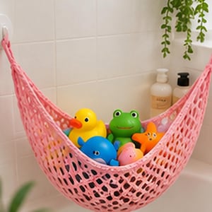 May include: A pink mesh storage hammock suspended by suction cups, containing several colorful plastic bath toys including a yellow duck, a green frog, a blue whale, an orange starfish, and a small pink fish, all arranged inside the net.