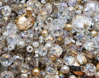 Perles transparentes, blanches et dorées