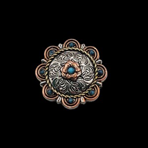 May include: A silver and copper colored metal buckle with a turquoise stone in the center. The buckle has a floral design and a rope border.