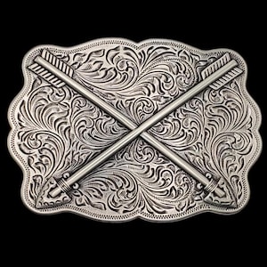 May include: Silver belt buckle with a decorative floral design and two crossed arrows.