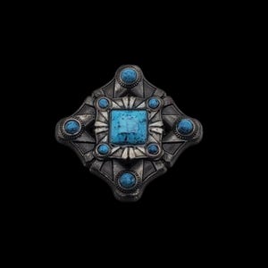 May include: A silver-toned, geometric brooch with a central square turquoise stone and smaller turquoise accents. The brooch has an ornate, vintage design, set against a black background.