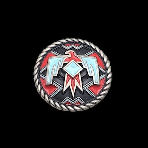 May include: A silver-toned metal button with a red, blue, and white Native American design. The design features a stylized eagle with a diamond shape in the center.