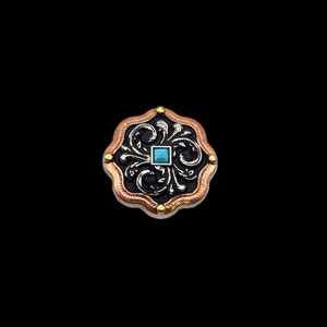 May include: A decorative metal button with a black background, silver filigree design, and a turquoise blue square in the center. The button has a copper-colored border with gold accents.