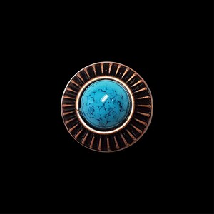 May include: A round, copper-colored button with a blue turquoise stone in the center. The button has a decorative, sunburst design around the stone.