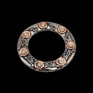 May include: A silver ring with a floral design and green and copper accents. The ring is decorated with a series of flowers with green centres and copper petals.
