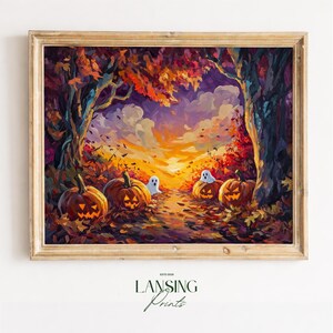 May include: A framed wall art print depicting a vibrant autumn forest scene at sunset with four glowing jack-o'-lanterns and two small white ghosts nestled among fallen leaves. The text "ESTD 2026 LANSING Prints" appears below the wooden frame.