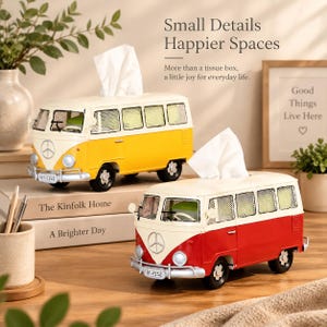 May include: Two metal tissue box covers shaped like vintage camper vans, one yellow and white and one red and white. Each van features a front bumper, round headlights, a circular emblem on the front, and a top opening for dispensing tissues.