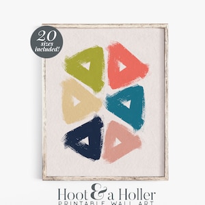 May include: Abstract geometric wall art print featuring six colourful triangles in shades of green, red, yellow, blue, and pink. The triangles are arranged in a circular pattern on a white background.