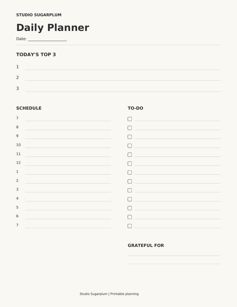 May include: A cream-colored daily planner page titled Studio Sugarplum Daily Planner. It features sections for Date, Today's Top 3, a numbered Schedule from 7 to 7, a To-Do list with checkboxes, and a Grateful For section at the bottom.
