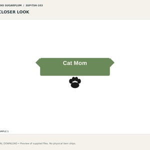 May include: A graphic design featuring the text Cat Mom in white letters centered on a solid olive green horizontal banner with pointed ends. Below the banner is a single black paw print icon. The text STUDIO SUGARPLUM / SSP-TSH-103 and A CLOSER LOOK appear at the top, with SAMPLE 1 at the bottom.