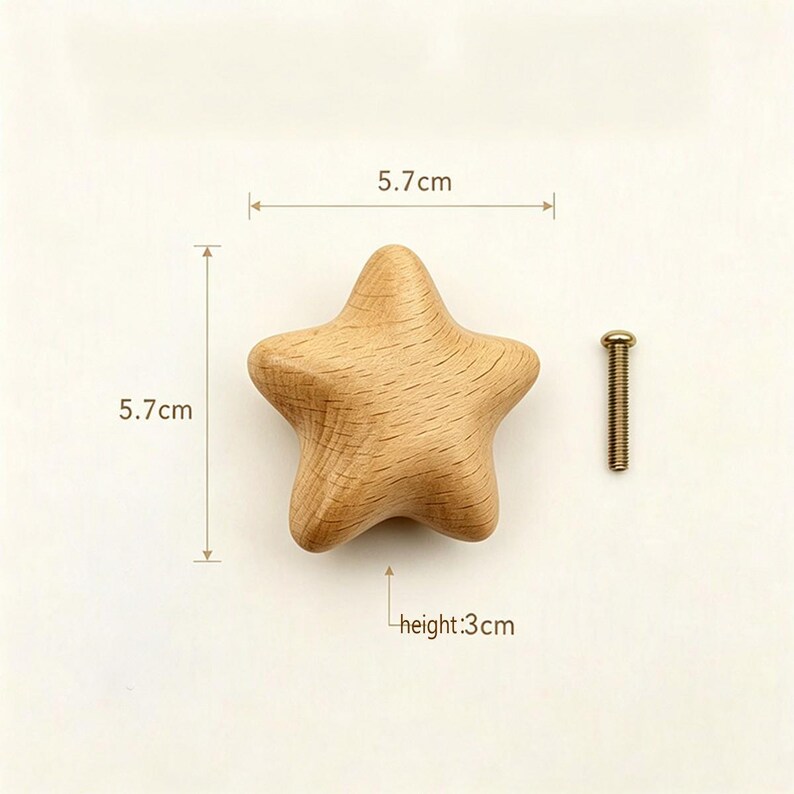 May include: A star-shaped wooden cabinet knob with a natural light brown wood grain finish. The knob measures 5.7 cm in width and 5.7 cm in length, with a height of 3 cm. A single metal mounting screw is positioned to the right of the wooden knob.