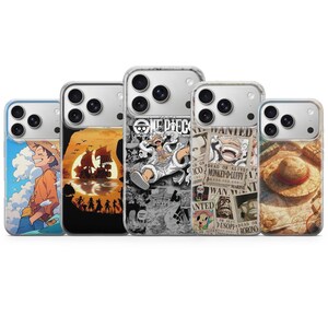 May include: Five clear smartphone cases featuring One Piece anime designs. The cases display various graphics including a character in a straw hat, a ship at sunset, a black and white manga collage, wanted posters, and a straw hat on a map.