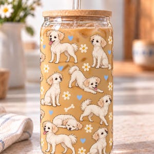 Example of a white dog full-body pattern repeated around a clear glass with ivory flowers and blue hearts.