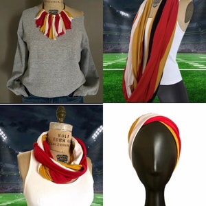 K&ouml;nnte beinhalten: Eine Sammlung von Accessoires, darunter ein graues Sweatshirt mit einer Halskette aus rotem, gelbem und wei&szlig;em Stoff, ein roter, gelber, schwarzer und wei&szlig;er Loop-Schal und ein passendes Stirnband. Die Artikel werden auf Schaufensterpuppen pr&auml;sentiert.