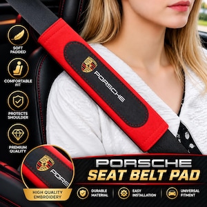 May include: A red and black seat belt pad featuring the Porsche logo and text. The pad is attached to a black seat belt. Text on the image includes Soft Padded, Comfortable Fit, Protects Shoulder, Premium Quality, High Quality Embroidery, Durable Material, Easy Installation, Universal Fitment, and Porsche Seat Belt Pad.
