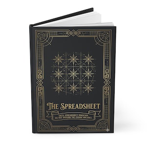 May include: A black hardback book with gold foil detailing on the front cover. The design features a grid of nine stars, geometric borders, and the text: The Spreadsheet, Excel Spreadsheet Magician, Do Not Disturb The Cosmic Balance.