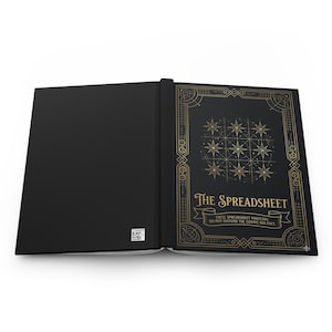 May include: A black hardcover book with gold foil detailing. The front cover features a grid of nine stars, a geometric border, and the text: The Spreadsheet, Excel Spreadsheet Magician, Do Not Disturb The Cosmic Balance. A small QR code is visible.