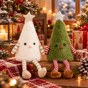 May include: Two plush cone-shaped figures resembling Christmas trees. One is white with a beige star and striped arms and legs. The other is green with a white star and red-and-white striped arms and legs. Both have black eyes.