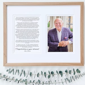 May include: A framed black and white photo of a man in a suit with a letter of congratulations on his retirement. The letter reads "Congratulations on your retirement!" and is signed "Tom Parish".