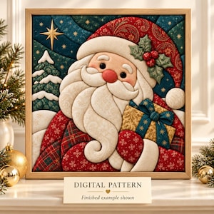 May include: A framed quilt-style wall art piece featuring a stylized Santa Claus with a white beard, red hat, and a gold gift box. The background shows a dark teal night sky with a gold star and evergreen trees. A sign reads DIGITAL PATTERN.