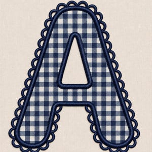 May include: An embroidered letter A patch featuring a navy blue and white gingham check pattern. The letter is outlined with a thick navy blue satin stitch border and finished with a decorative scalloped edge in the same navy blue thread color.