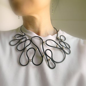 Abstract Black Leather Bib Necklace: Contemporary Silver Accent Choker