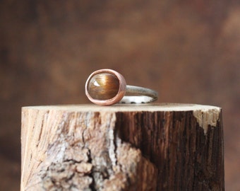 4.75 (5) cat's eye | tanzanian sunstone cabochon gemstone ring with star | mixed metal sterling silver + copper | blooms and shrooms