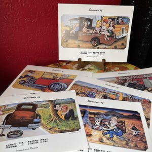 May include: A collection of vintage-style prints, each featuring colorful illustrations. The top print showcases a Model T truck with passengers. Other prints depict various scenes, including a hot rod, a man reading, and a desert scene. The prints are labeled "Souvenir of" and "Model T Truck Stop".