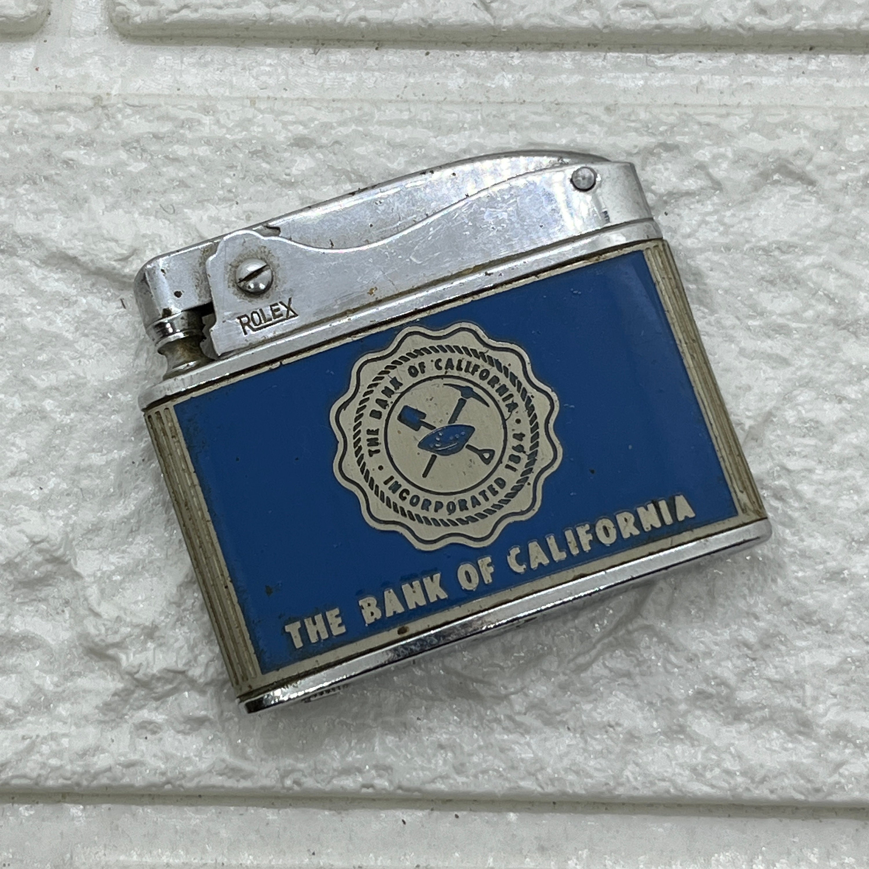 Vintage Rolex Advertising Lighter Bank of California Blue Enamel