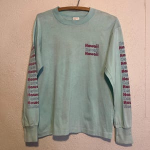 May include: A set of three ceramic mugs with a speckled, matte finish. The mugs are in shades of cream, light gray, and dark gray. Each mug has a simple, minimalist design, perfect for coffee or tea.