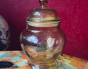 パイオニアシードのロゴが入った、ユニークなヴィンテージのペブルドガラス製薬瓶スタイルの蓋付き瓶