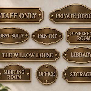 May include: A collection of ten rectangular, oval, and circular bronze-toned metal signs with raised lettering and decorative borders. The signs feature text including STAFF ONLY, PRIVATE OFFICE, GUEST SUITE, PANTRY, CONFERENCE ROOM, THE WILLOW HOUSE, LIBRARY, MEETING ROOM, OFFICE, and STORAGE.