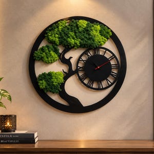 May include: A circular black wall clock featuring a stylized tree silhouette with vibrant green preserved moss foliage. The clock face displays black Roman numerals and thin black hands with a red second hand, all set within a circular frame.