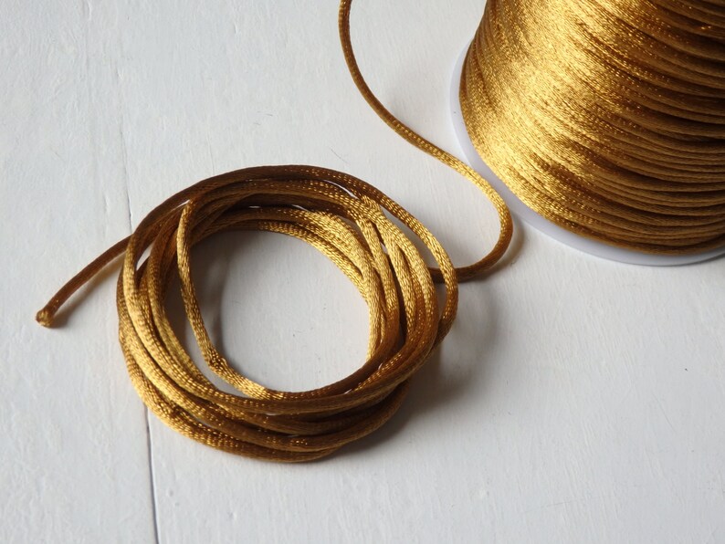 thumbnail image 2 of Red With Gold Metallic Satin Rat Tail Cord Gimp Sewing Trim 2-3mm... 2 of 13