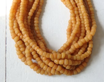 Handmade Indonesian Glass Beads:  Saffron Yellow, (4-6mm), 24" Strand