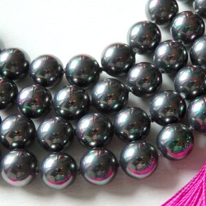 Hilo de perlas de concha gris oscuro de 8 mm: cuentas de nácar iridiscente