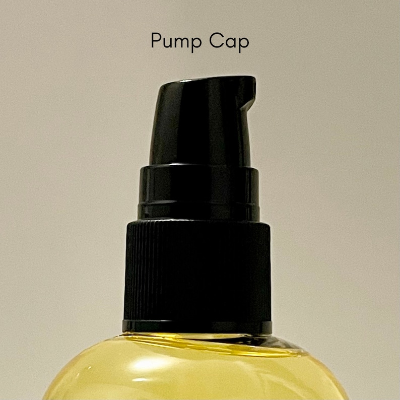 May include: A black pump cap on a clear glass bottle filled with a yellow liquid. The text "Pump Cap" is written above the bottle.