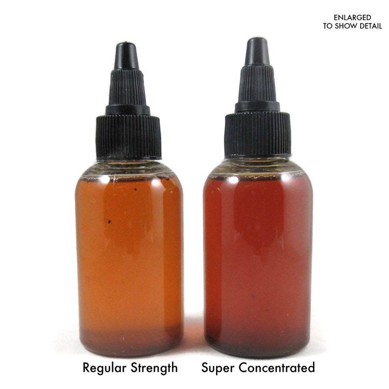 May include: Two amber glass bottles with black dropper caps. The bottle on the left is labelled "Regular Strength" and the bottle on the right is labelled "Super Concentrated".